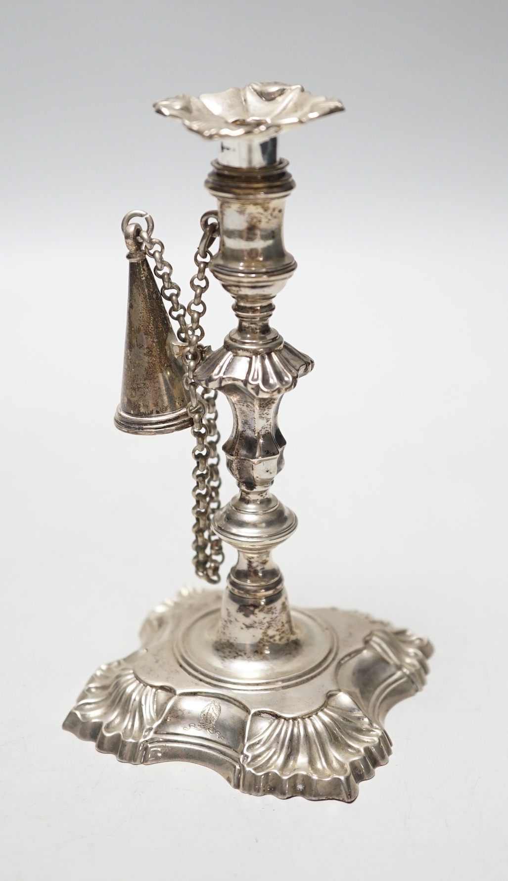 A George II cast silver taper stick, William Gould, London, 1751, with later George IV extinguisher and unmarked sconce, 13.3cm, 6.7oz.